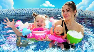 Maya looks for toy eggs with Orbeez balls inside, and then goes swimming with them.