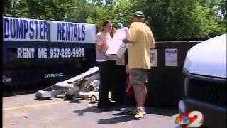 Moving out: People leave storm damaged apartment