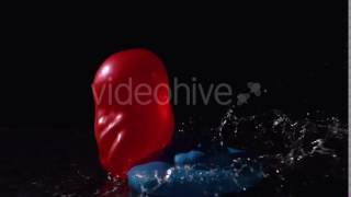Red And Blue Water Balloons Falling On Black Background - Stock Footage | VideoHive 11283275