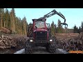 4K| Komatsu 875 Forwarder Unloading Timber