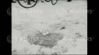 1929 GERMANY: Fishing under the ice at Muggelsee