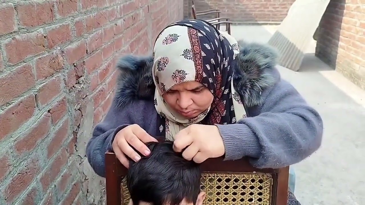 Hair checking of my son.