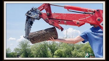 Kubota BX23s backhoe vs. log