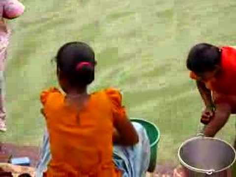 Watch these women beating the hell out of their clothes in Badami, India.