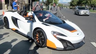 A bespoke white mclaren 675lt spider with black and orange accents by
special operations (mso) arriving at leaving cars chronos hing wa
le...