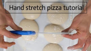 Hand stretching pizza