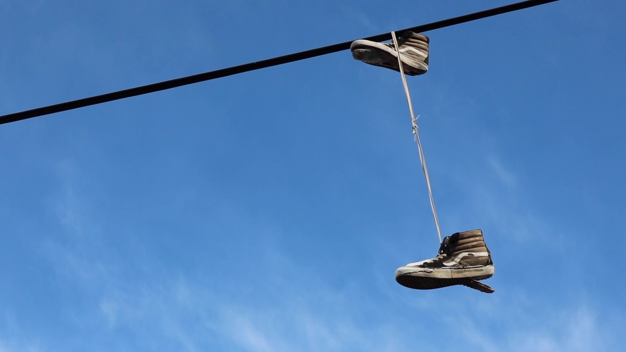 Sneakers on power lines hi-res stock photography and images - Alamy