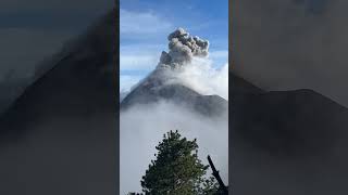 Person Capturing a Volcanic Eruption from a Nearby Base Camp