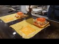 Ham cheese toast covered with egg blanket  fold and eat  korean street food