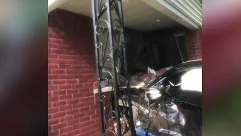 Car crashes into woman's home