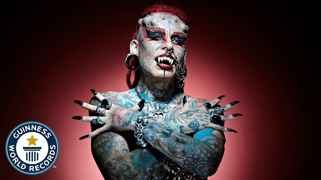 9. Maria Jose Cristerna, also known as "The Vampire Woman", has extensive body modifications including tattoos, piercings, and dental implants. - wide 9