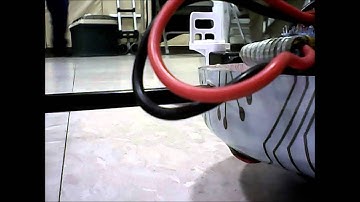 Syma X5SW trying to flip over a Syma X1 on Floor