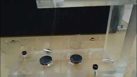 Chaotic oscillations in tristable magnetoelastic oscillator