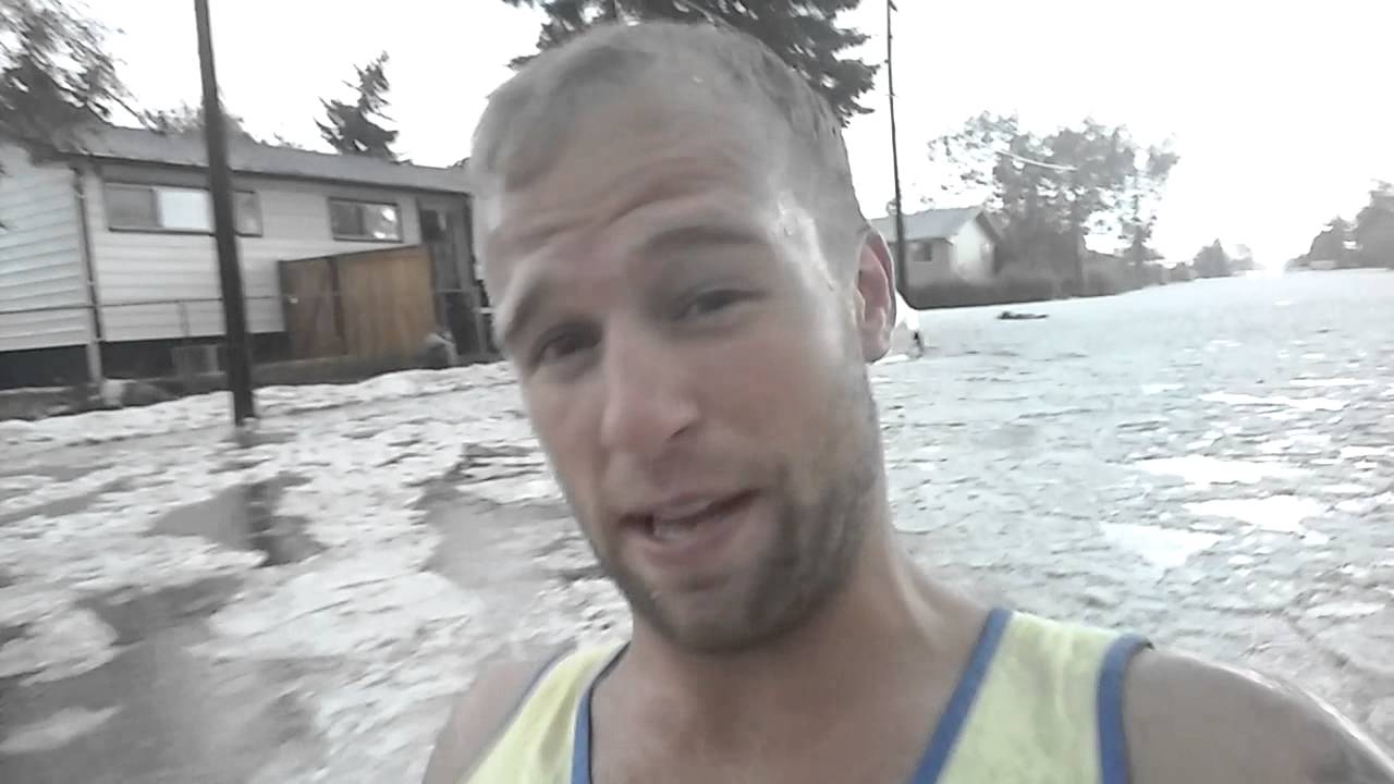 Guy floating down street in calgary flood aug 2015 YouTube