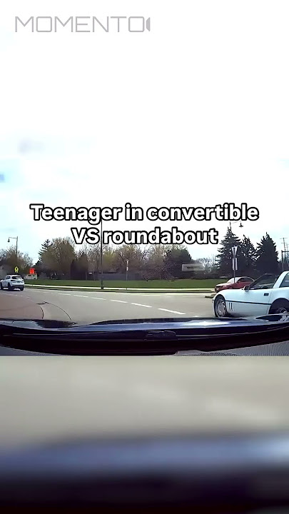 Teenager in convertible VS Roundabout