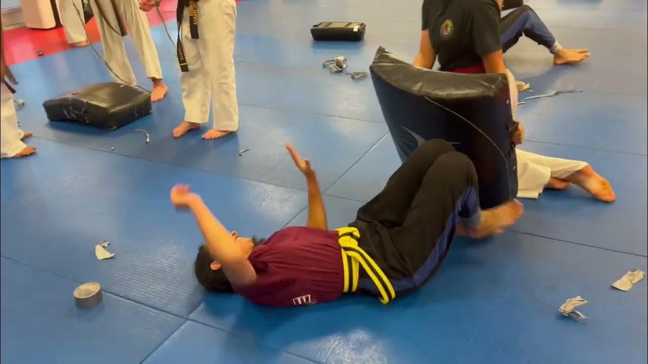 Everson's Karate Institute teens learning how to escape being duck