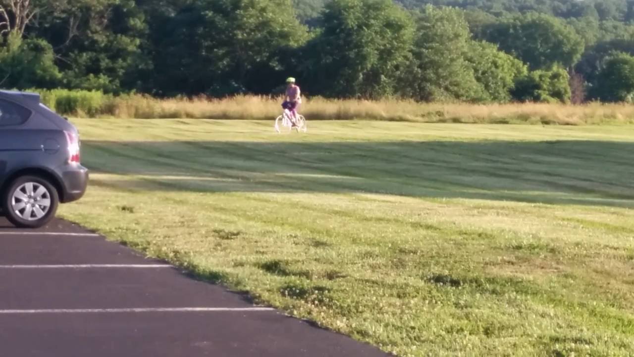 Michelle chasing down groundhogs with her bicycle - YouTube