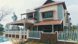 A traditional house constructed using a mix of laterite stone and bricks.