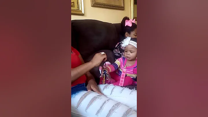 Baby talks to herself, then beats Auntie with keys
