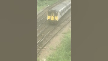 A Class 317 and Class 745 pass on the railway