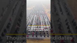 Thousands of candidates sit for government exam on airstrip in India