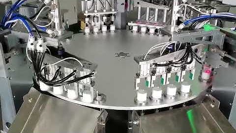 Automatic flip top cap lid assembly machine