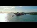 Coal loader sydney  ship is being tugged by 3 tugboats