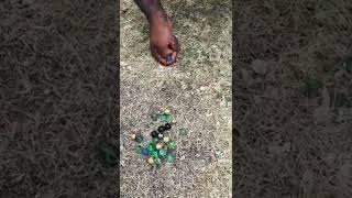 Teaching my Canadian husband how to play marbles 🇨🇦🇯🇲 #marbles #jamaican #games screenshot 2