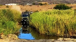 Driving through water after good rains in the Agter Hantam of South Africa