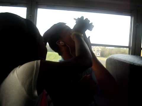 tyree on the bus. trying to clean eye. hahaha.