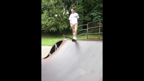 Geek fails on half pipe with skate board