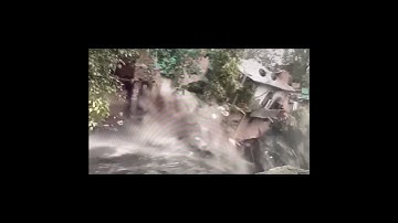 Massive sinkhole swallows building.