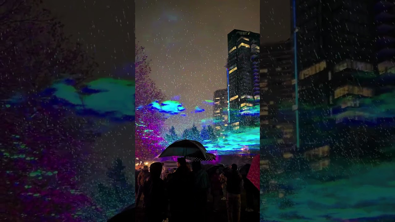 Light projections in the dark rain sky