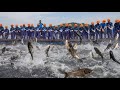 Fishermen catch fish with giant nets in Qiandao Lake