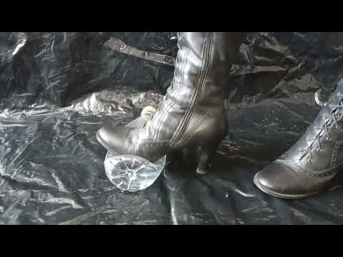 Sondra Heels Lady L crush plastic bottle with black sexy extreme ultra mistress leather boots.