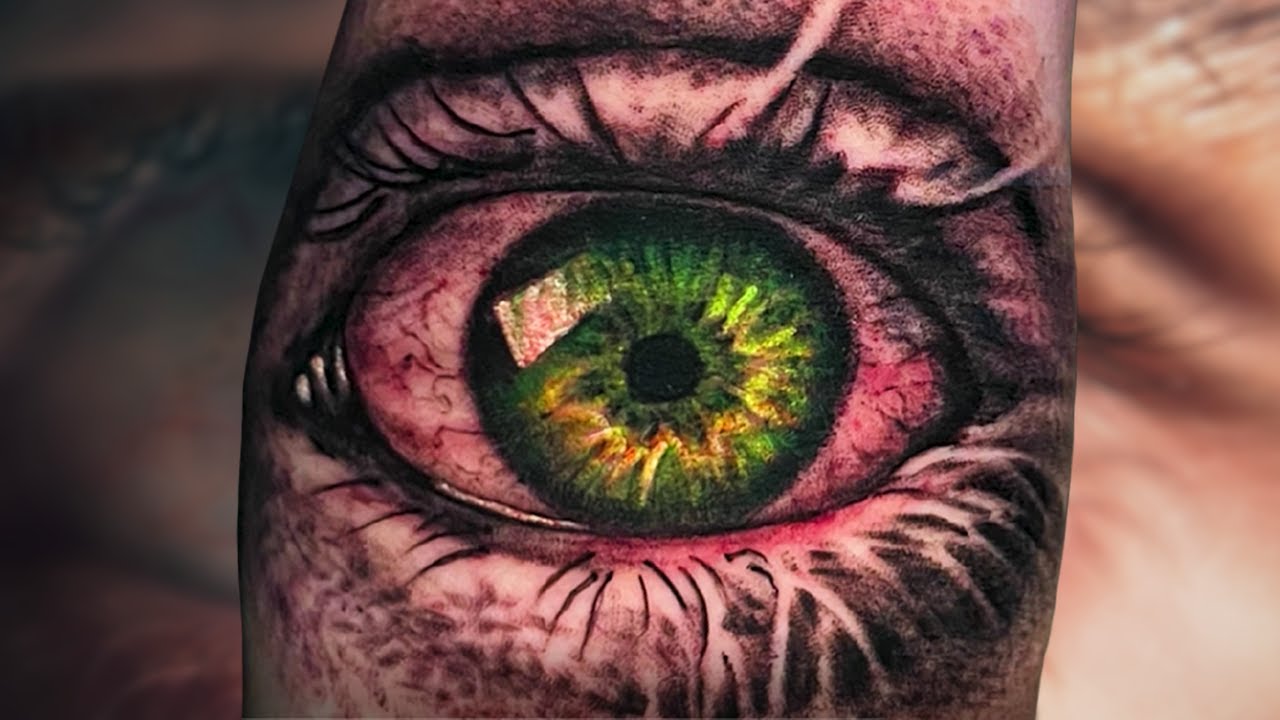 Skull w green eyes tattoo