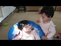 TWINS GIRLS GIVING RIDE TO EACH OTHER ON THEIR MOON CHAIR 😍 #twins #funny #adorable #baby #babies