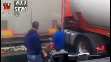 Immigrants trying to enter illegally into a truck in Calais - France