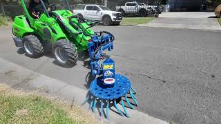 Slanetrac MB900 MultiBoom with RB80 Hard Wire Brush Clearing Weeds from Gutter