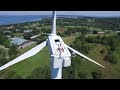 Drone captures man sunbathing on wind turbine
