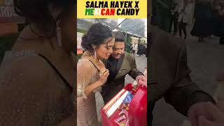 Salma Hayek takes candy from Pero Like at the Golden Globes