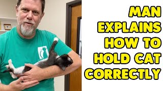 Man Wholesomely Explains How To Correctly Hold A Cat