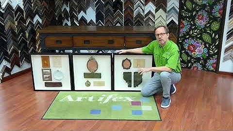 Antique items arranged in custom shadow boxes