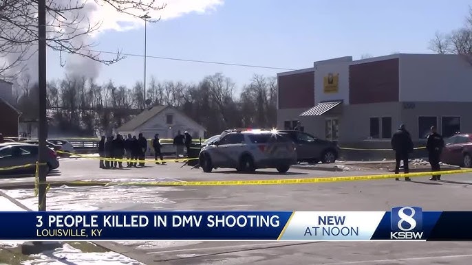 a police car is parked in front of a building with police tape