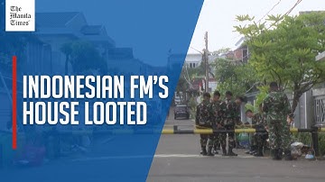 Soldiers secure looted home of Indonesian FM