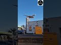 That plane is flying very low over the petrol station ⛽️