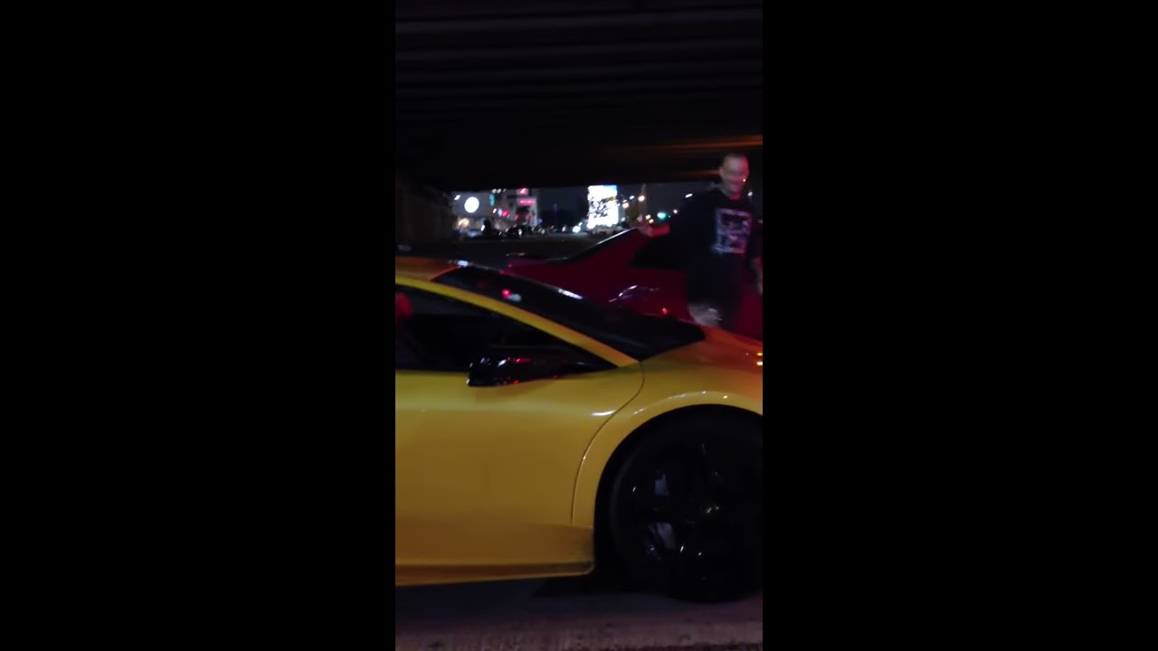 Guy Attempts To Wash The Windshield Of A Lamborghini At Sto