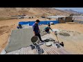 "Cementing the roof of Abu's kitchen with Mohammad's effort and skill"