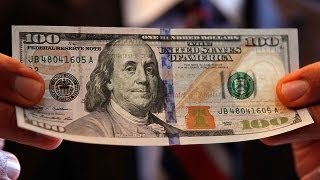 Redesigned $100 Bill Arrives to Briefly Deter Counterfeiters