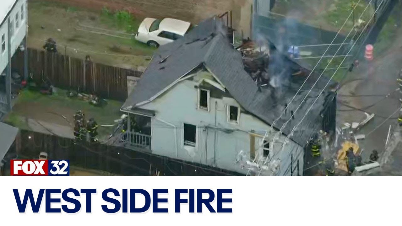 Fire rips through roof of home on West Side, prompting large emergency ...